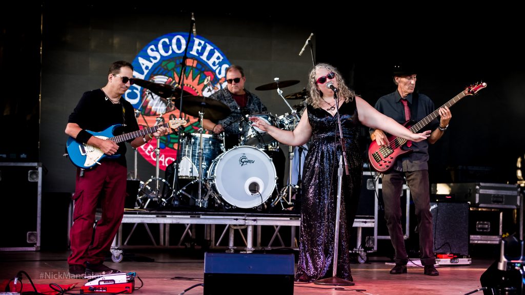 Julie Black & Her Band playing live original music on stage at the 2023 Chasco Fiesta Festival NPR Florida